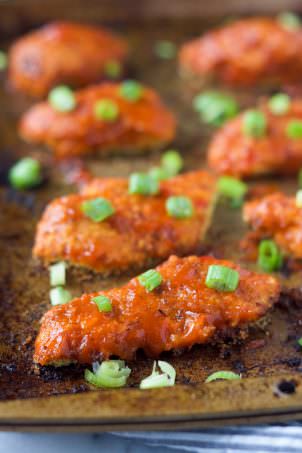Sticky Sweet Chili Glazed Chicken Fingers are baked then coated in a sweet and spicy glaze for a healthy, delicious dinner!