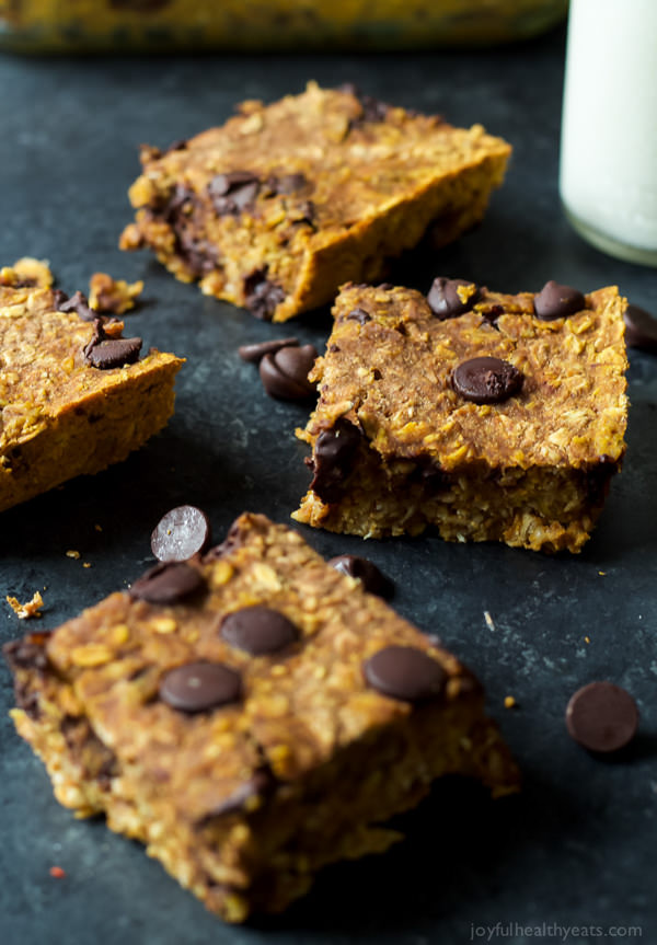 Skinny Chocolate Chip Pumpkin Bars are filled with fall spices, pumpkin puree, oats, and dark chocolate! All for only 107 calories a serving!