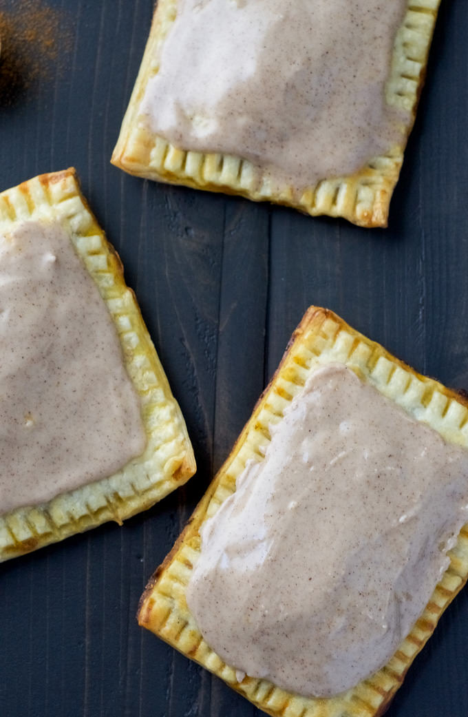 Skip the store-bought and make these simple, fall inspired Pumpkin Brown Sugar Cinnamon Pop Tarts! Using premade pie crusts, they come together quick and are perfect for any morning!