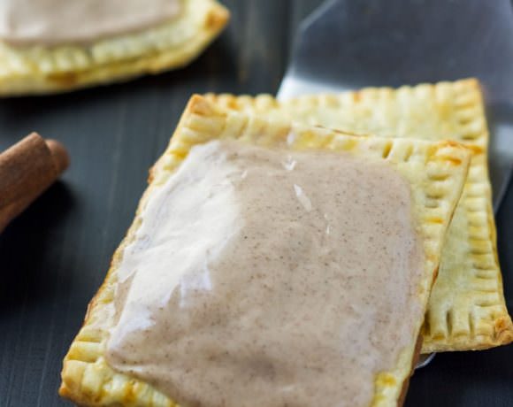 Skip the store-bought and make these simple, fall inspired Pumpkin Brown Sugar Cinnamon Pop Tarts! Using premade pie crusts, they come together quick and are perfect for any morning!