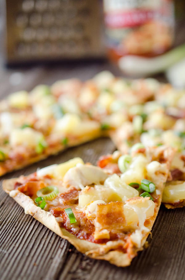 Light Pineapple, Chicken & Bacon Pizza is an easy and healthy dinner with juicy pineapple, sharp Manchego cheese, shredded chicken and crispy bacon on a thin and crispy tortilla crust. 