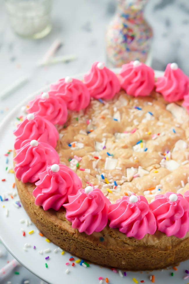 This White Chocolate Funfetti Cookie Cake is a spin on the classic cookie cake - a buttery cookie filled with white chocolate chunks and loads of sprinkles! 