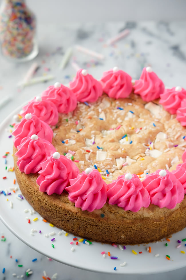 This White Chocolate Funfetti Cookie Cake is a spin on the classic cookie cake - a buttery cookie filled with white chocolate chunks and loads of sprinkles! 