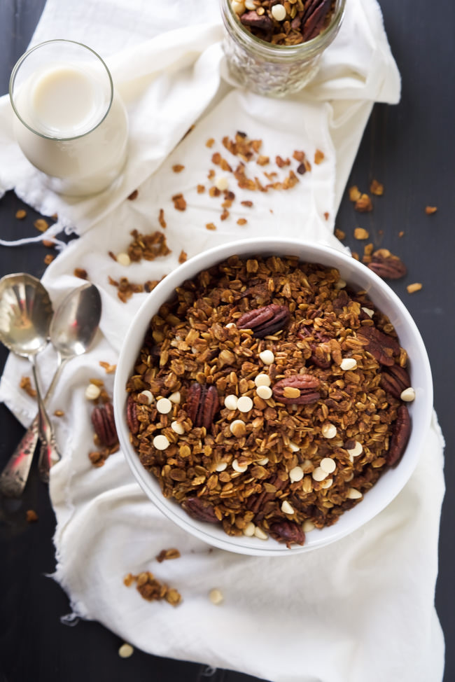 A slow cooker makes this granola so easy to make! Filled with fall flavors, this Slow Cooker Pumpkin Granola has roasted pecans, cranberries and white chocolate!