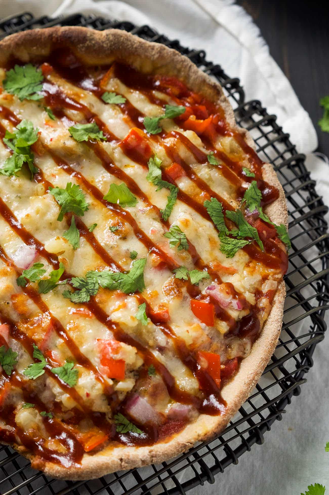 Cast Iron Skillet Chipotle BBQ Chicken Pizza is our new favorite way to make pizza! Sweet and spicy BBQ Chicken pizza has a crispy crust thanks to the cast iron skillet!