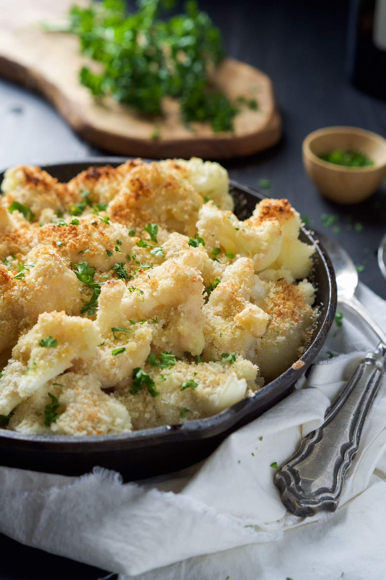 Garlic Gouda & Parmesan Cauliflower Au Gratin is the perfect side dish for your holiday table but easy enough for any weeknight dinner! Tender cauliflower blanketed in a double cheese sauce and crunchy panko topping!