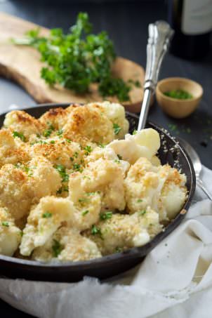Garlic Gouda & Parmesan Cauliflower Au Gratin is the perfect side dish for you holiday table but easy enough for any weeknight dinner! Tender cauliflower blanketed in a double cheese sauce and crunchy panko topping!
