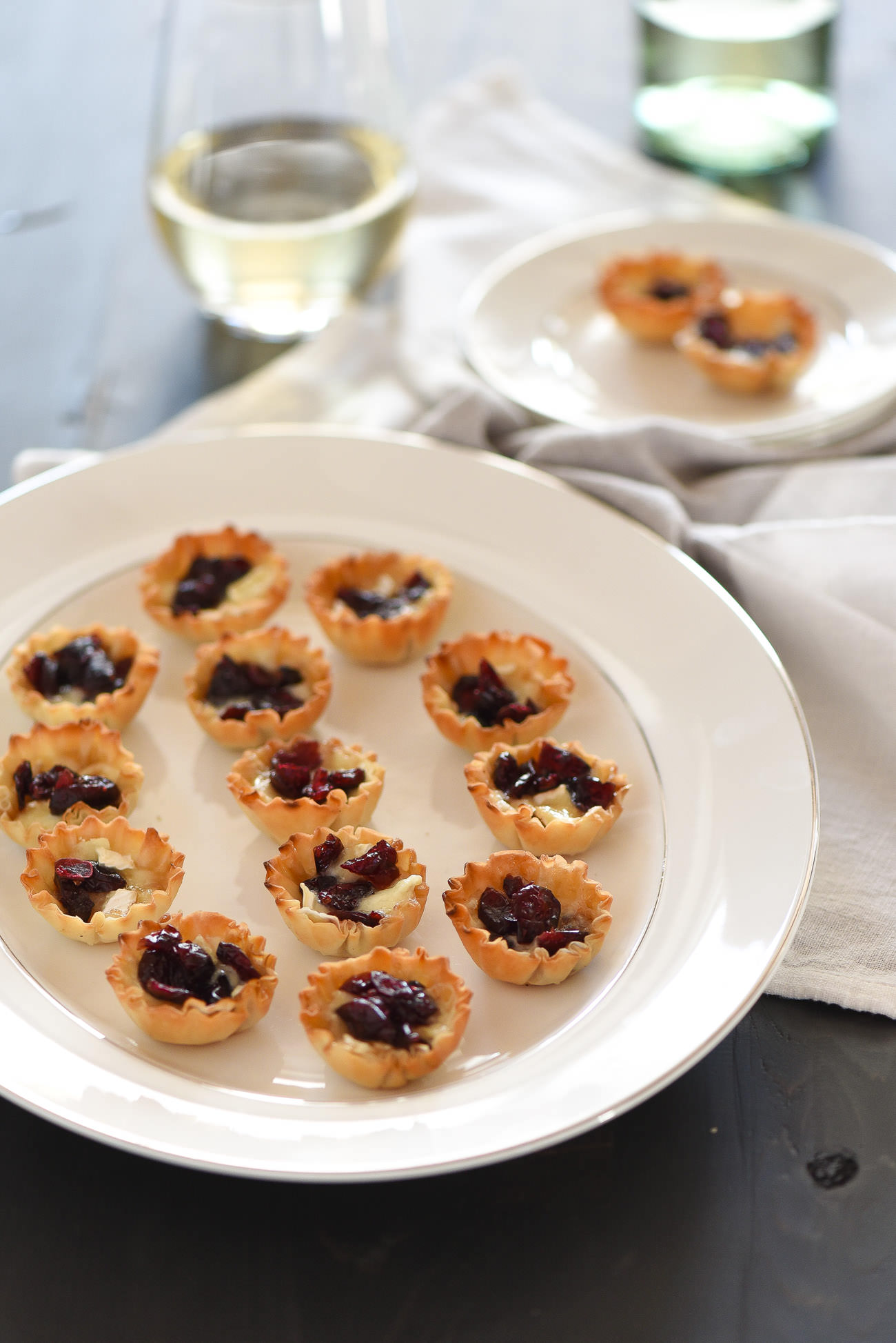 Cranberry, Brown Sugar Brie Bites are the perfect party appetizer. They are sweet, savory and are whipped together in under 20 minutes! 
