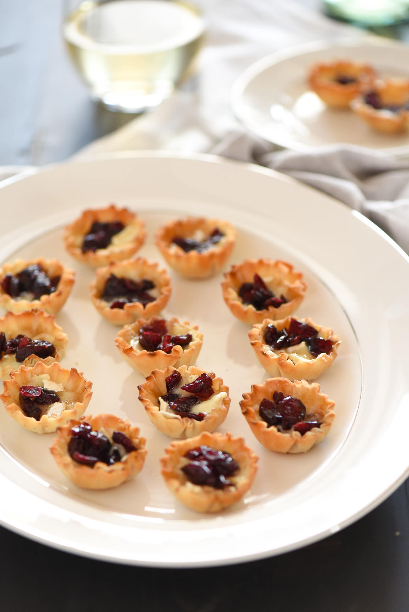 Cranberry, Brown Sugar Brie Bites are the perfect party appetizer. They are sweet, savory and are whipped together in under 20 minutes! 