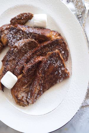Dark Hot Chocolate French Toast is a breakfast that combines two breakfast favorites! Rich, chocolately french toast that is perfect topped with marshmallows for a delicious start to any day!