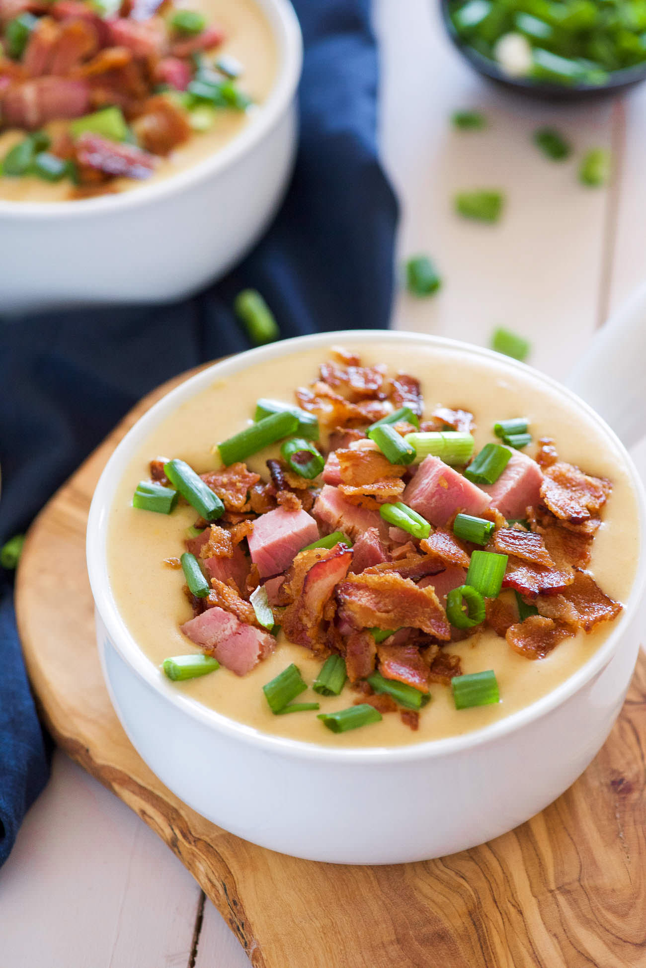 For those cheese and beer lovers - this Ham and White Cheddar Beer Cheese Soup is delicious creamy and full of flavor thanks to two types of cheese, beer, ham and bacon!