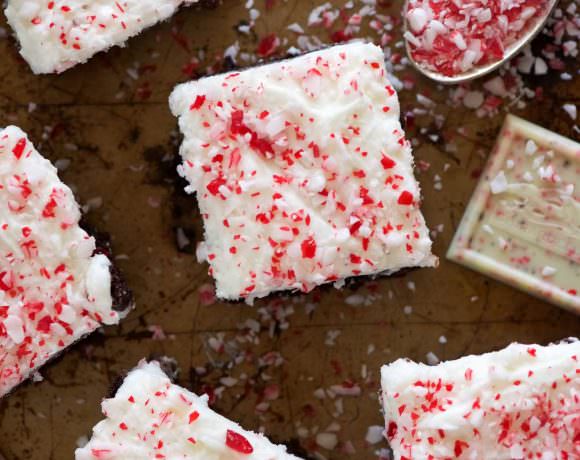 Peppermint White Mocha Brownies have a fudgy brownie base, filled with white chocolate and coffee! Then finished with a buttery peppermint frosting. A holiday dessert table must!
