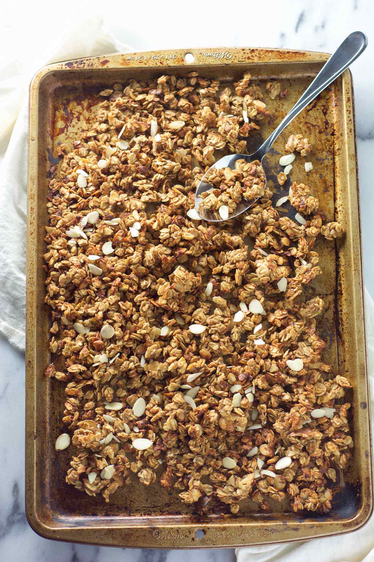 Vanilla Almond Macaroon Granola is a blend of toasted coconut, almonds and honey that tastes like you are eating a vanilla macaroon cookie!