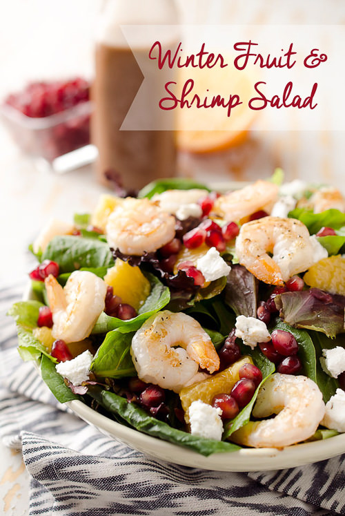 Winter Fruit & Shrimp Salad is a healthy entree salad filled with sweet pomegranate seeds and oranges, along with grilled shrimp and creamy goat cheese for a dinner idea that will brighten up these cold days.