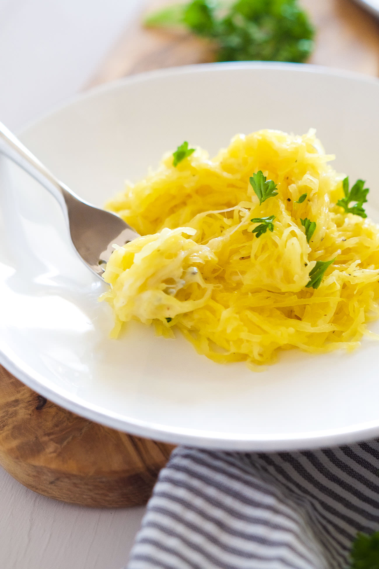 Garlic Brown Butter Spaghetti Squash is quick and healthy side dish that is super cheesy and tossed in nutty garlicky browned butter! One bite and you won't believe how light it really is!