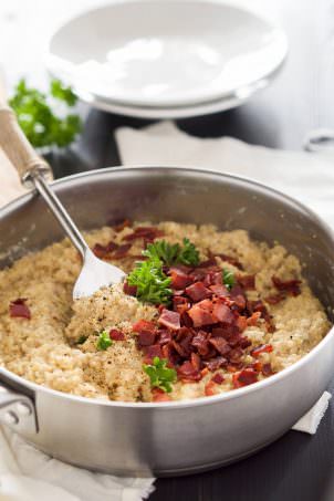 Goat Cheese & Mushroom Quinoa Risotto is a shortcut version of the classic risotto! Creamy goat cheese, bacon and quinoa come together in under 30 minutes and require minimal hands on time; making this the perfect healthy, side dish!