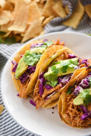 Slow Cooker Honey Chipotle Chicken Tacos are slightly sweet and slightly spicy! The slow cooked chicken is fall apart tender, juicy and full of chipotle and honey! Delicious in tacos or over lettuce for a lighter option!