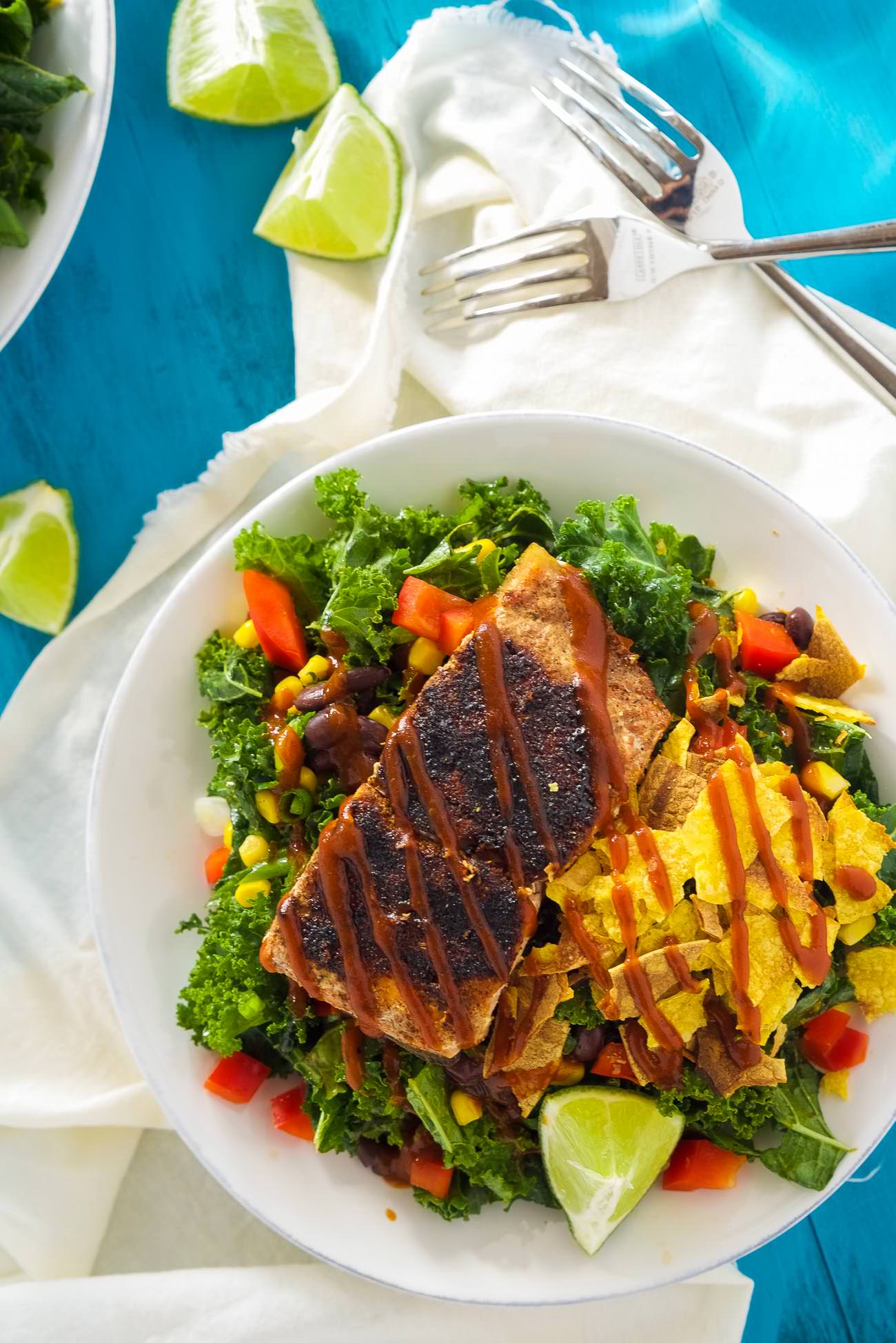 BBQ Salmon Kale Salad is a healthy and updated version of the classic BBQ salad! Filled with bold flavors, crunchy kale, crispy vegetables and all toss in a Honey Chipotle Vinaigrette! One easy to prepare salad you will fall in love with!