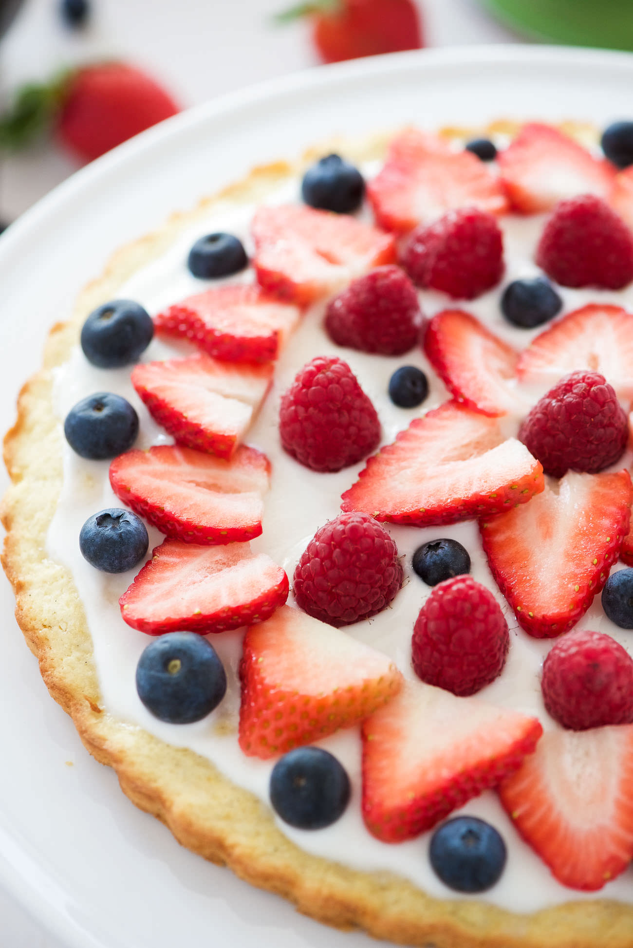 This Berry Tart with Lemon Cookie Crust has made all my spring dessert dreams come true! A citrus cookie crust topped with vanilla greek yogurt and fresh berries! The ideal and simple dessert to impress any guest!