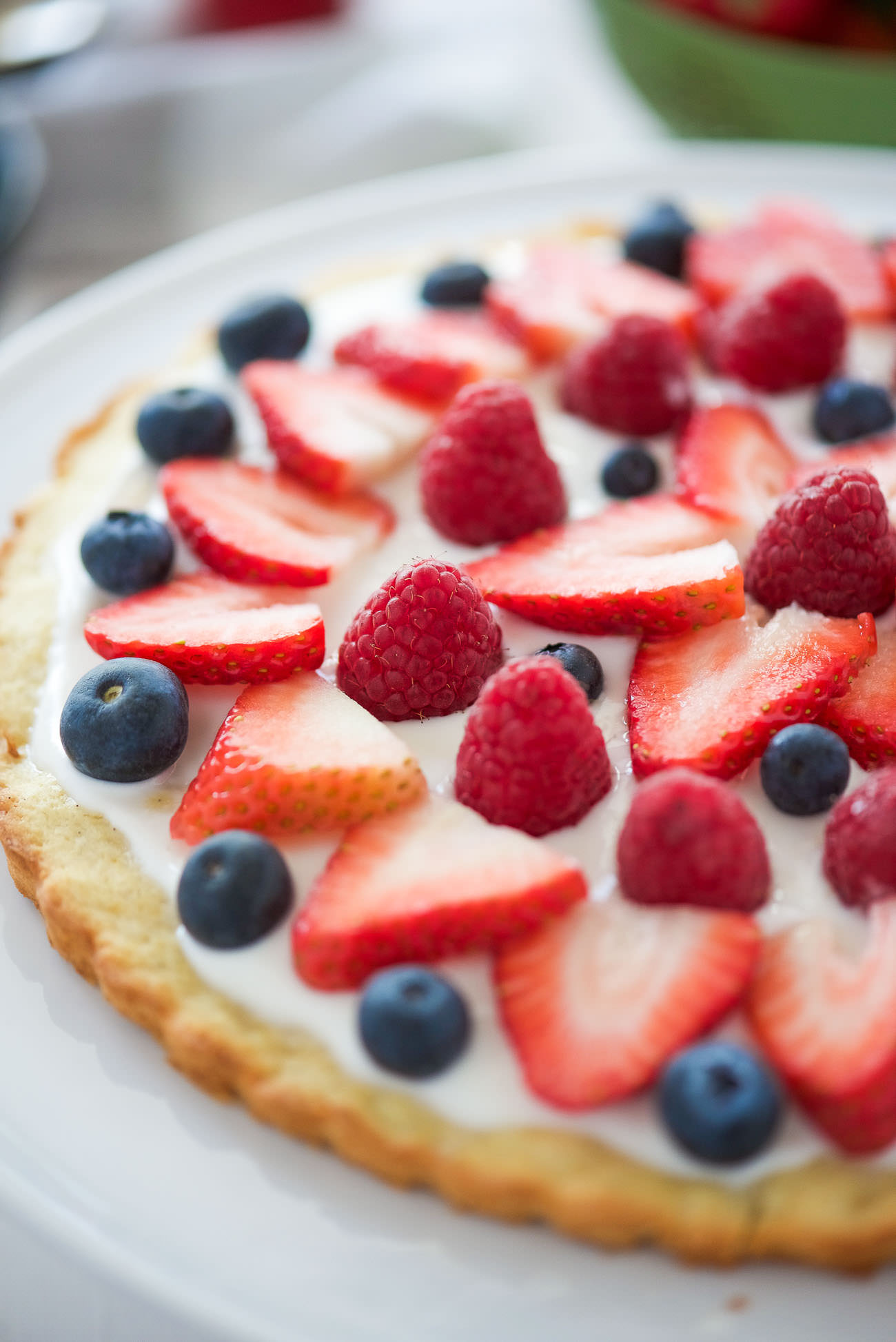 This Berry Tart with Lemon Cookie Crust has made all my spring dessert dreams come true! A citrus cookie crust topped with vanilla greek yogurt and fresh berries! The ideal and simple dessert to impress any guest!
