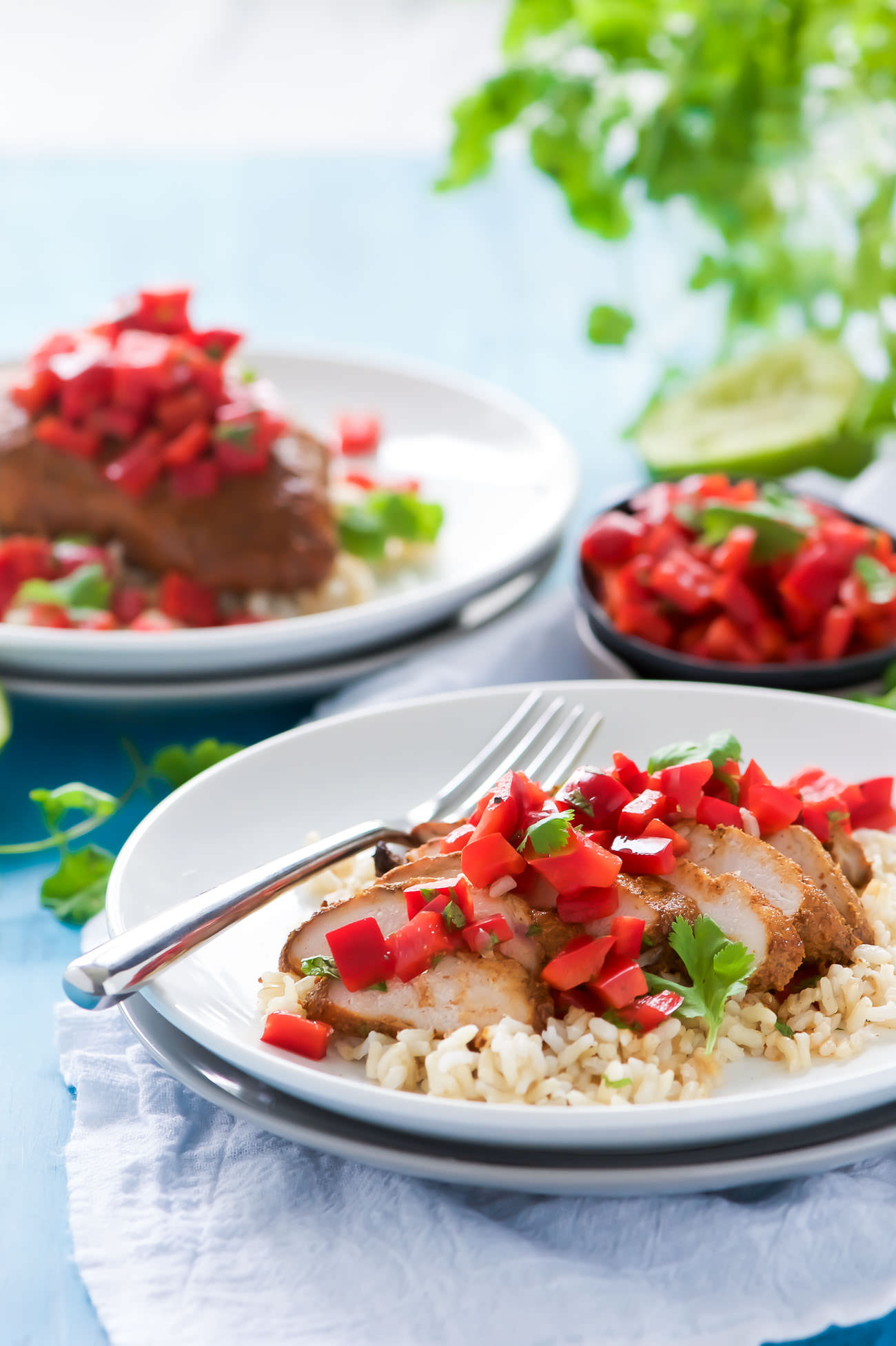 Tequila Honey Lime Chicken - juicy chicken marinated in a smoky chipotle, a touch of honey and chili powder then finished with a super quick and fresh red pepper salsa!