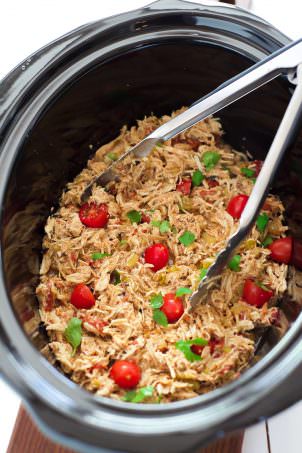 My Favorite Slow Cooker Shredded Mexican Chicken is a time saver and household top pick! Simply throw the chicken in with seasonings and come home to perfectly juicy, shredded chicken! Add to enchiladas, tacos or top salads!