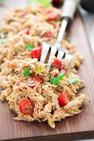 My Favorite Slow Cooker Shredded Mexican Chicken is a time saver and household top pick! Simply throw the chicken in with seasonings and come home to perfectly juicy, shredded chicken! Add to enchiladas, tacos or top salads!