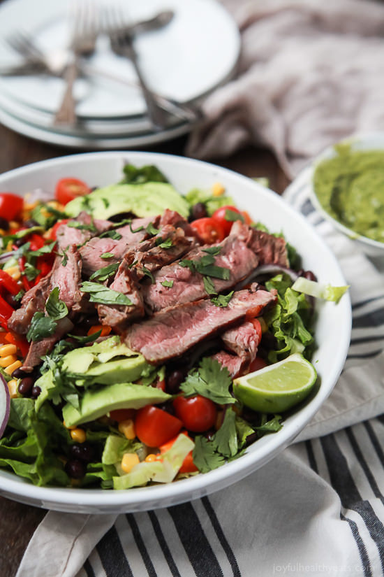 An easy healthy Southwestern Steak Salad loaded with vegetables, tender Ribeye Steak and then topped with a homemade Cilantro Avocado Dressing! Done in 15 minutes, low on calories and rivals any restaurant salad!