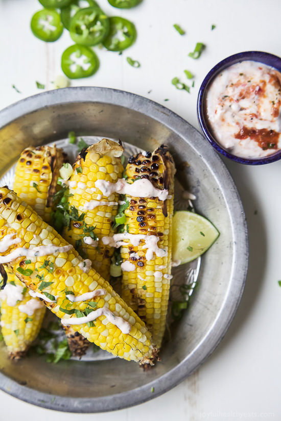 Mexican Corn just got blown out of the water! This Easy Grilled Corn on the Cob is topped with a Creamy Roasted Jalapeno Sauce you’ll swoon over! This grilled corn is the new star of the summer!