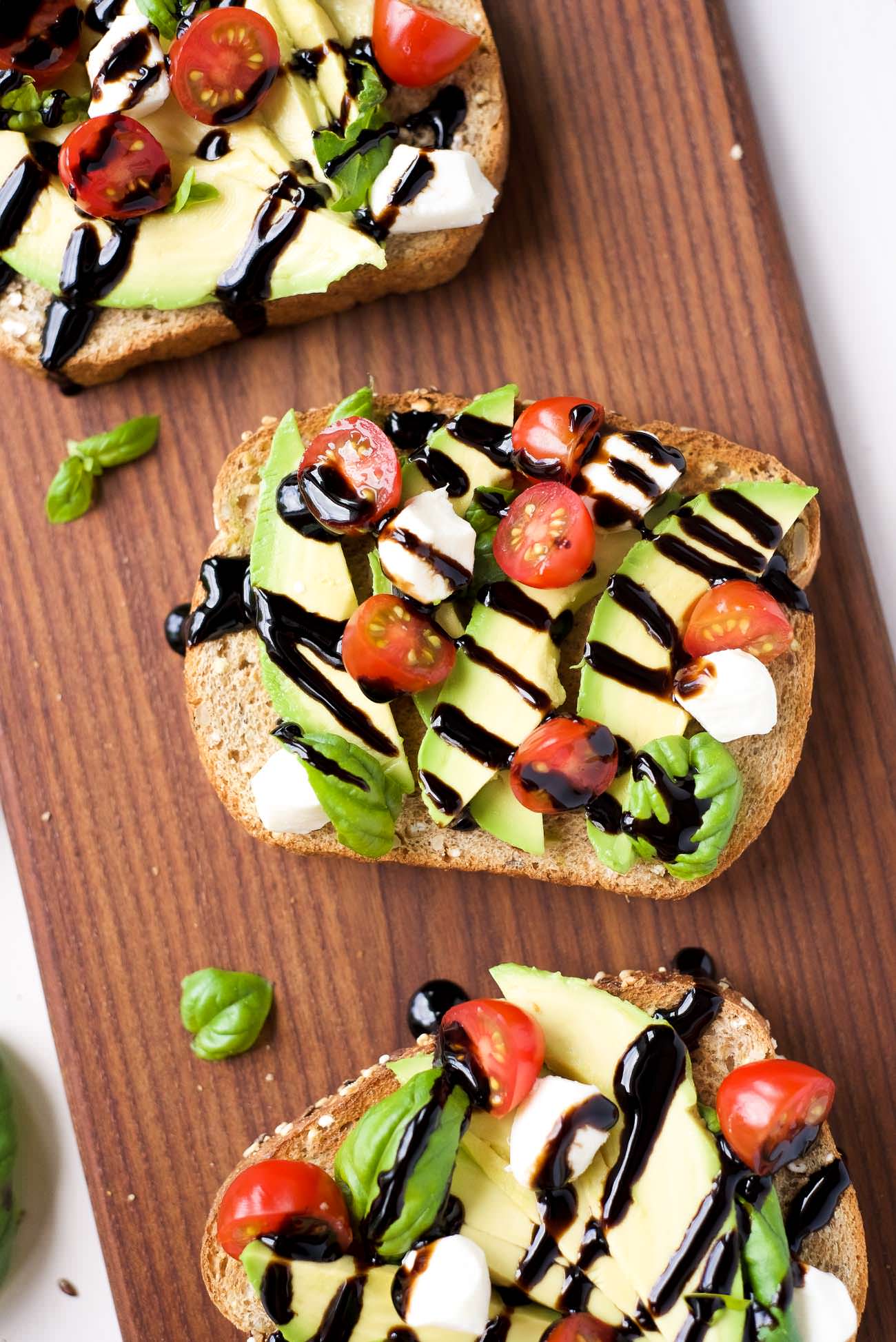 Caprese Avocado Toast is my go to, healthy snack! Full of good for you ingredients, this snack is ready in 10 minutes and easy enough to feed a crowd! 