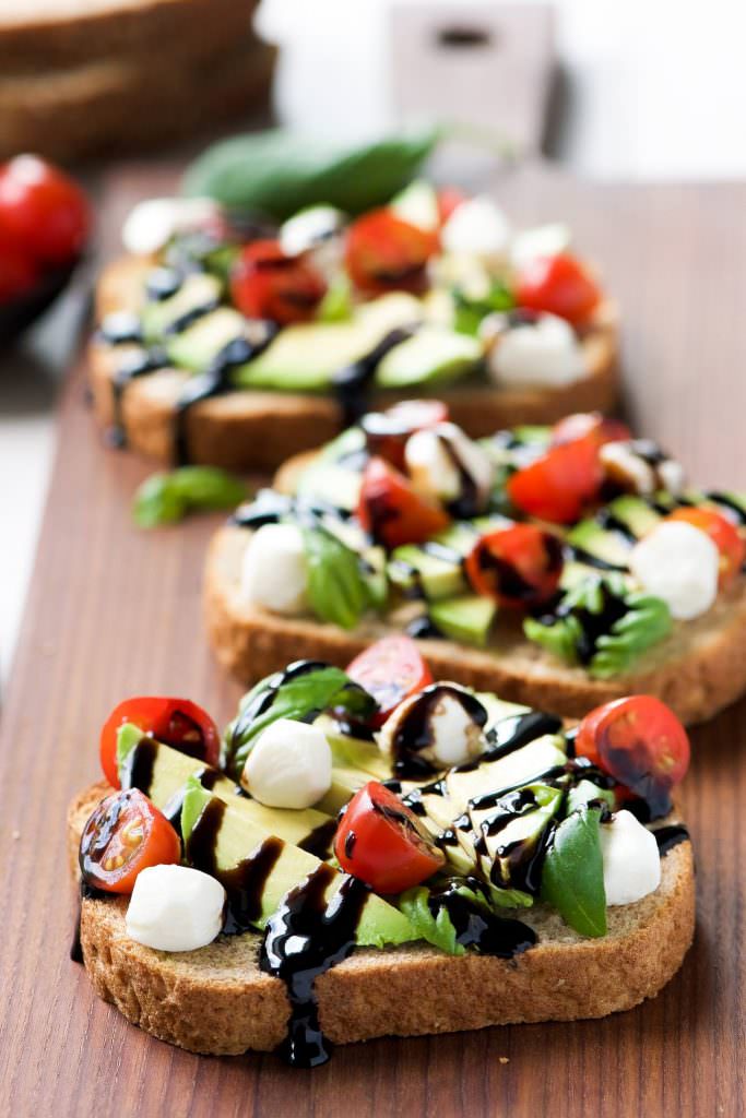 Caprese Avocado Toast is my go to, healthy snack! Full of good for you ingredients, this snack is ready in 10 minutes and easy enough to feed a crowd!