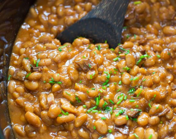 These Slow Cooker Healthy Maple Bacon Baked Beans are a barbeque, get together must have! A healthy twist on the classic bacon baked beans that allows your slow cooker do all the work!