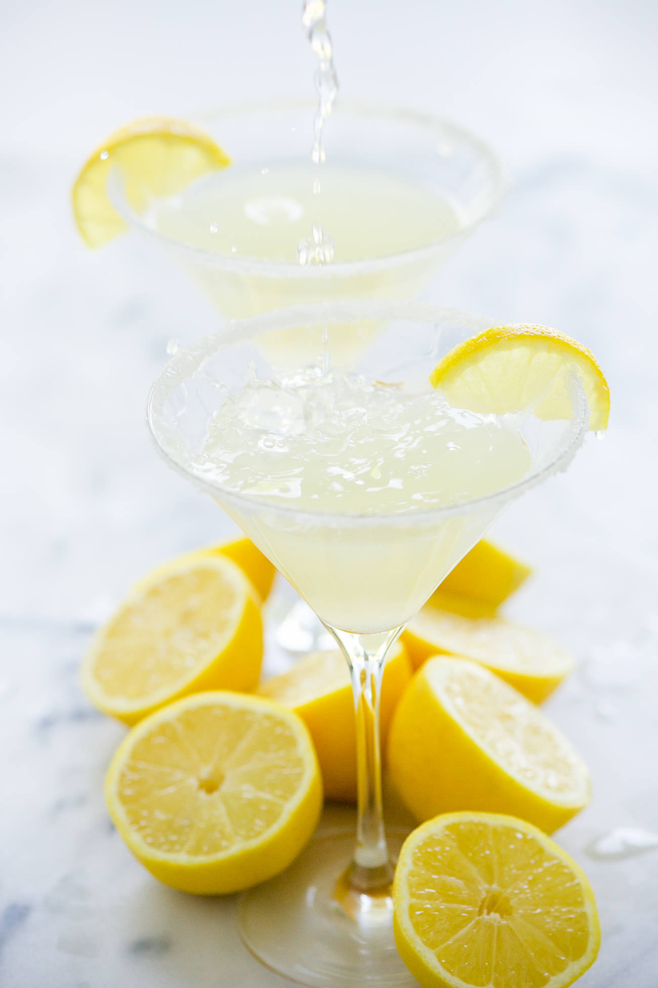 This Sparkling Lemon Drop Martini is much more than a shake and a stir! Fresh lemon juice, vodka and topped with sparkling water make this drink tart, sweet and easy to drink!