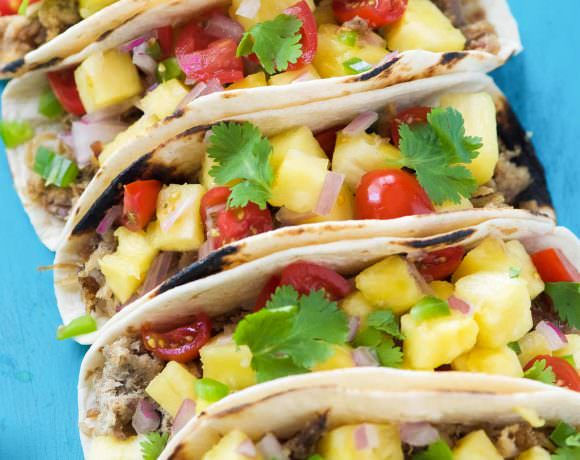 Hawaiian BBQ Pork Tacos are filled with crispy, spiced pork and topped with an irresistible and juicy Pineapple Pico de Gallo! The ideal summer street taco!