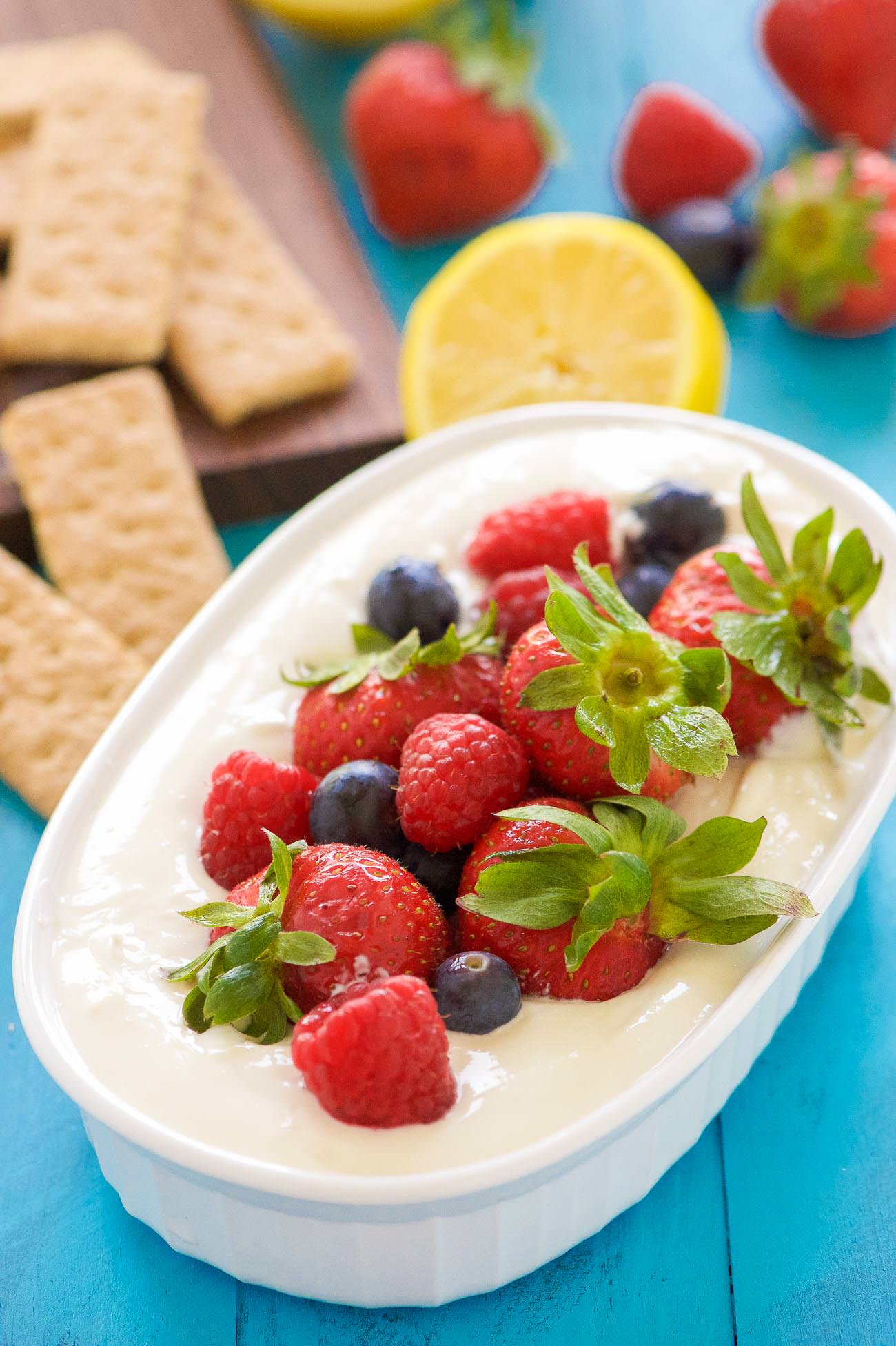 Lemon Berry Cheesecake Dip is the best of both words - dessert and a dip! Luscious, creamy cheesecake dip with a hint of lemon is topped with juicy berries coated in a touch of maple syrup! An irresistible combination that will be the hit of any party!