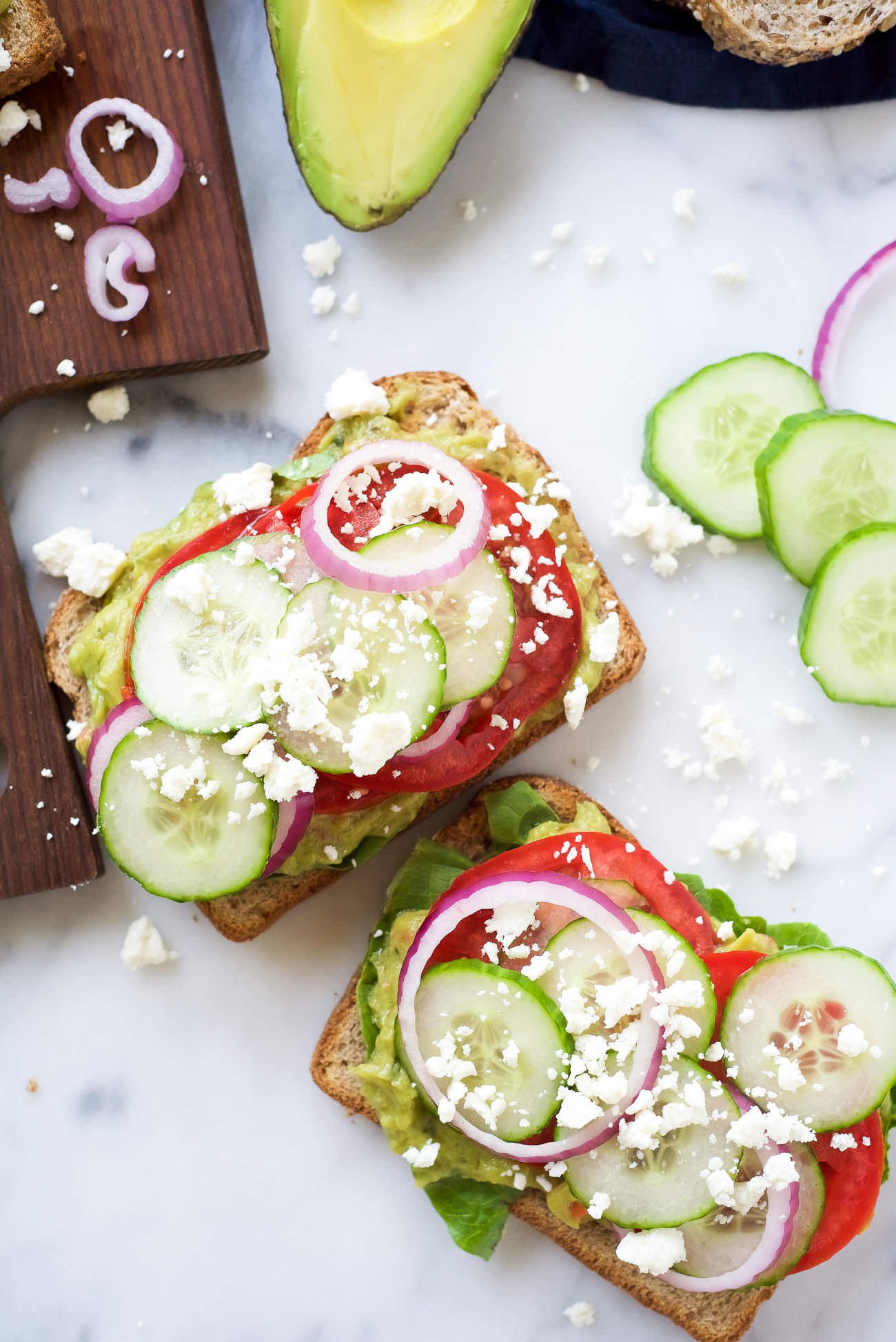 Mediterranean Avocado Toast is a spin off of my favorite veggie filled sandwich from Panera that satisfies both vegetarians and meat-lovers! A super quick and fresh, colorful sandwich - garden veggie filled guacamole, crispy cucumbers, red onions, juicy tomatoes and salty feta! 
