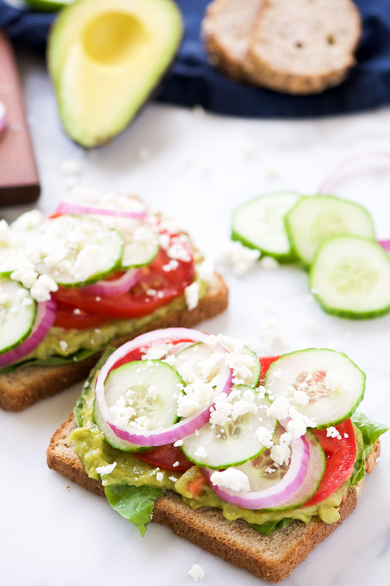 Mediterranean Avocado Toast is a spin off of my favorite veggie filled sandwich from Panera that satisfies both vegetarians and meat-lovers! A super quick and fresh, colorful sandwich - garden veggie filled guacamole, crispy cucumbers, red onions, juicy tomatoes and salty feta! 
