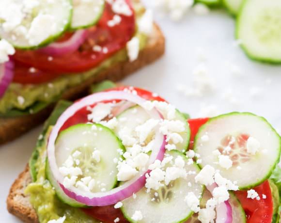 Mediterranean Avocado Toast is a spin off of my favorite veggie filled sandwich from Panera that satisfies both vegetarians and meat-lovers! A super quick and fresh, colorful sandwich - garden veggie filled guacamole, crispy cucumbers, red onions, juicy tomatoes and salty feta!