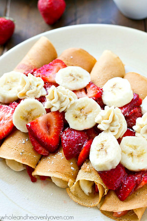 These Strawberry Banana Cheesecake Crepe Enchiladas will be the hit of your entire brunch table! My favorite crepe recipe stuffed with a cheesecake filling and tons of fresh strawberry sauce and bananas.—you won’t be able to stop eating them!