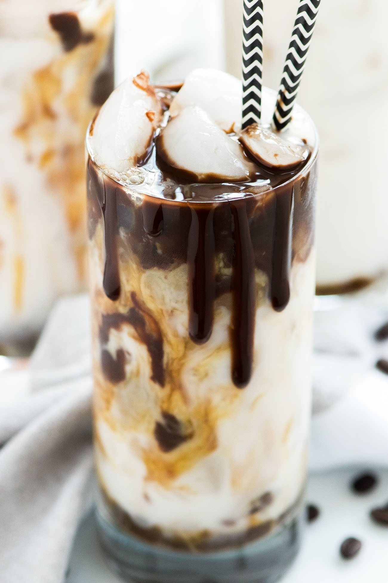 Iced Coconut Milk Mocha Macchiato is just how I want to start each day or give my afternoon a java jolt! Creamy coconut milk swirled with rich chocolate and topped with espresso. So fancy you will be calling yourself a barista!