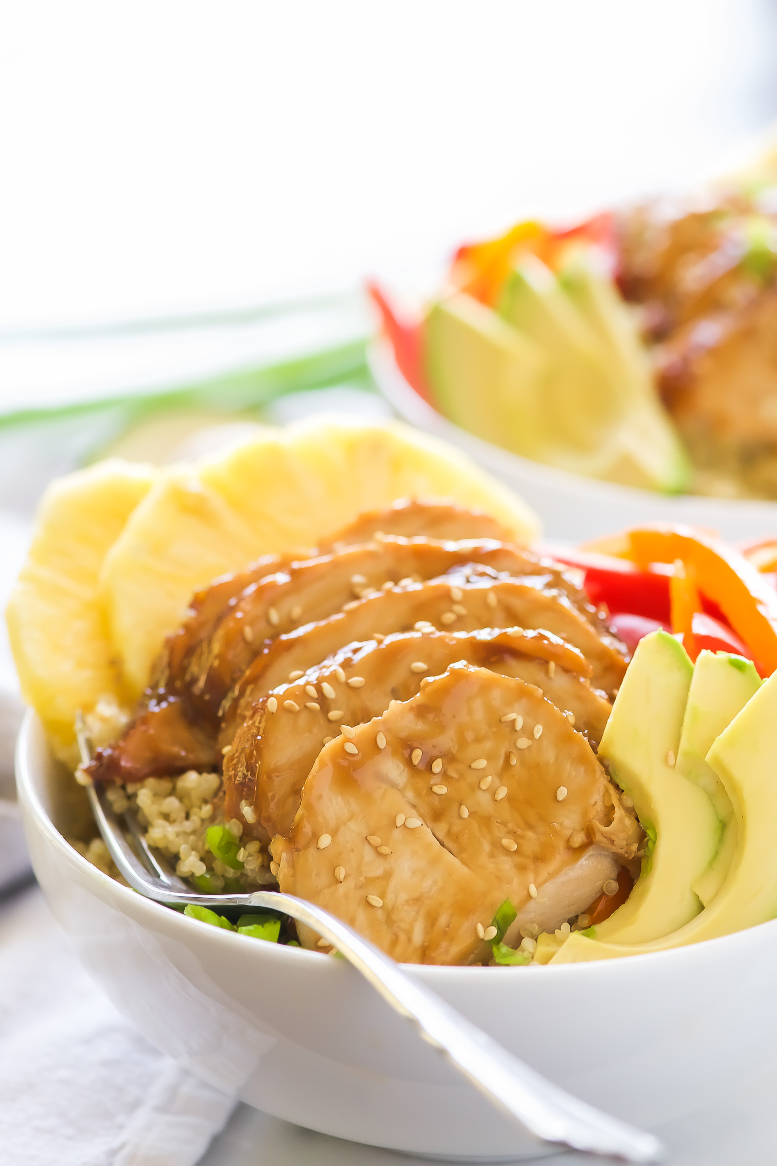 Honey Soy Glazed Hawaiian Bowls pack a serious flavor punch! Honey soy glazed turkey tenderloins are baked then added to bowl filled with rice, juicy pineapple, peppers, onions, and avocados. This one dish wonder is perfect for any weeknight dinner!