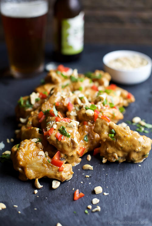 Crispy Baked Chicken Wings made in the oven then tossed in a Spicy Thai Peanut Sauce. Believe me you’ll be licking your fingers after this one!