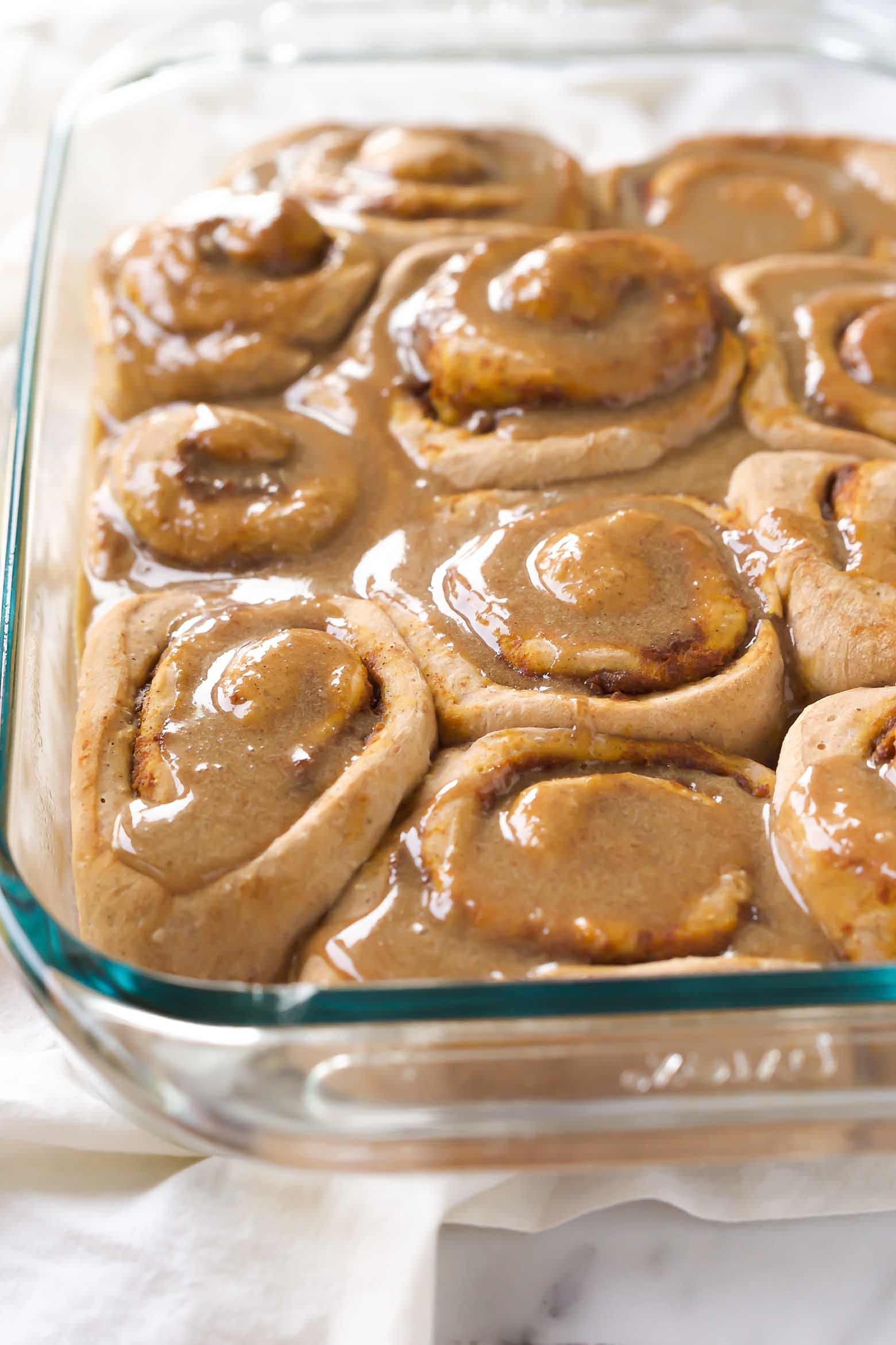 These Pumpkin Cake Mix Cinnamon Rolls are made easier by starting with a cake mix then drizzled in a delicious brown sugar maple glaze! Your family will love waking up to these!