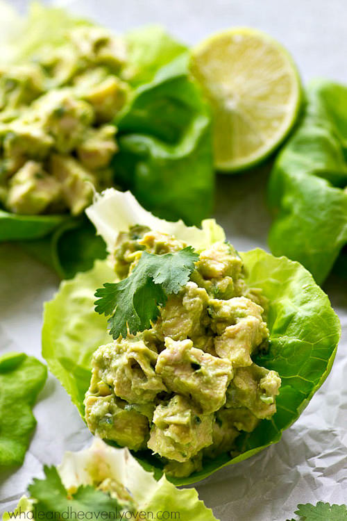 Chicken salad lettuce wraps lightened up with healthy avocado and NO mayonnaise at all! These wraps are going to quickly become a lunch favorite.